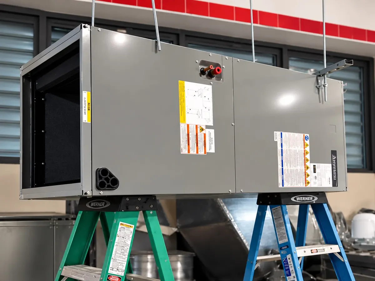 Commercial air handling unit with large insulated ductwork serviced by Arijen